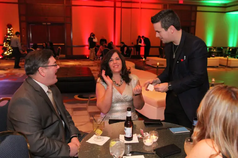 Corporate entertainment walk-around performance with David Hall engaging guests through close-up mind reading and magic