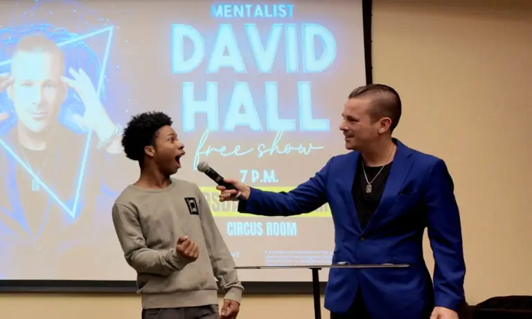 David Hall performing a mind reading show for college students on stage.
